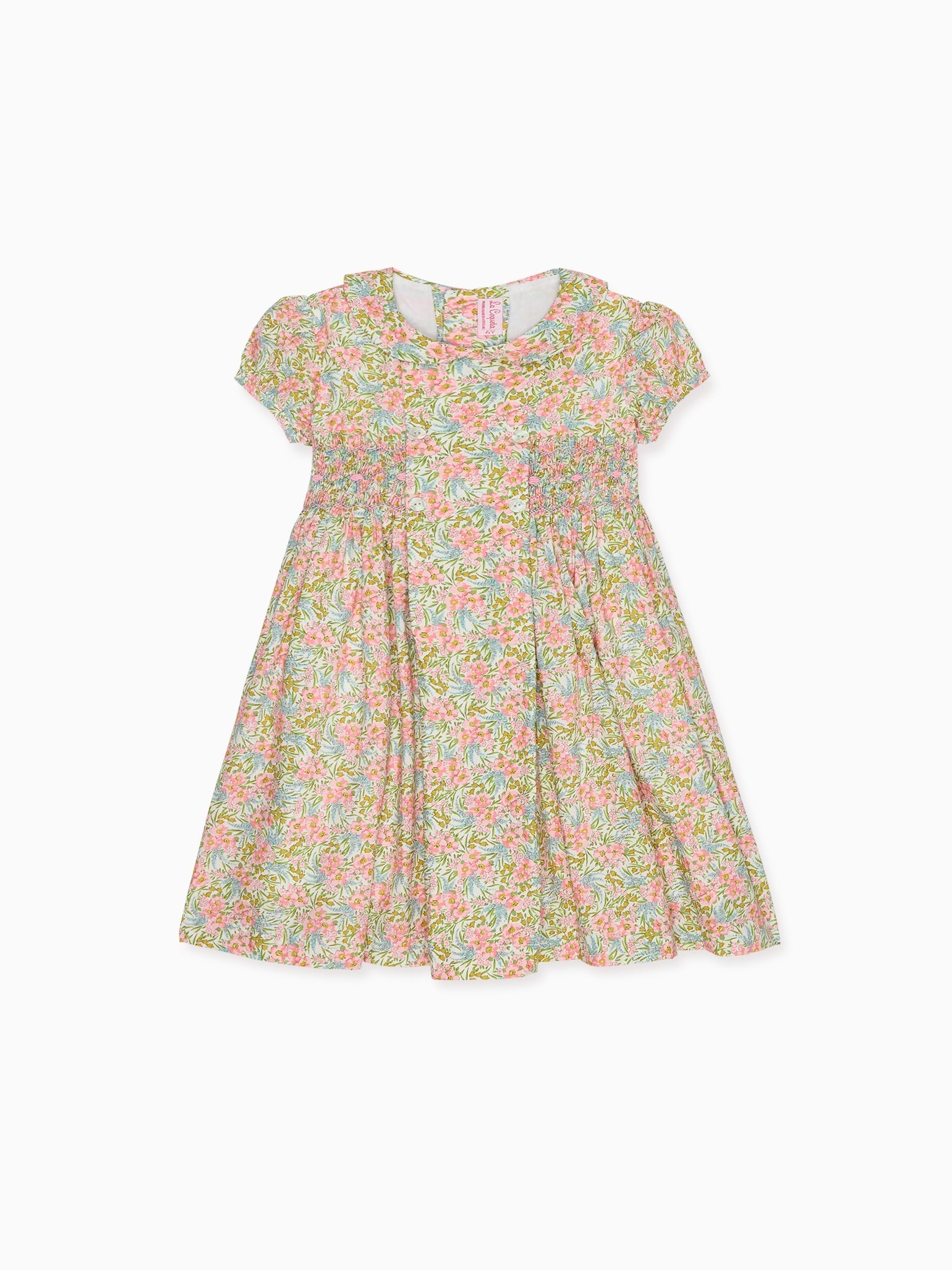 Robe fillette smockée main en tissu fleuri rose